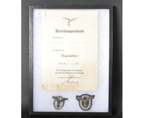 A WWII Second World War Third Reich Nazi German Luftwaffe Pilots qualification certificate and badges. The certificate awarde