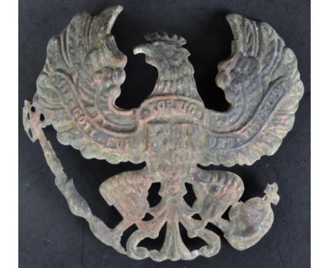 A WWI First World War Imperial German Army Pickelhaube helmet front plate / badge. The plate depicting a spread-winged eagle.