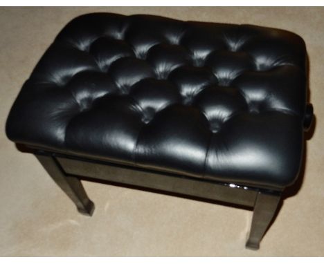 Piano StoolA concert adjustable piano stool in a bright ebonised finish with button leather top.