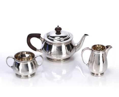 Silver three piece bachelors teaset the teapot having wooden finial and handle, with inscription that reads "D. R Evans Esq, 