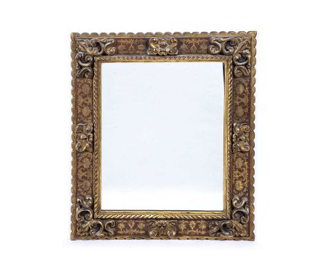 Giltwood Flemish style mirrorwith a carved frame, 86cm x 71cmA few light marks and some wear.