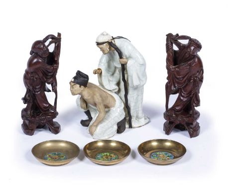 Glazed figure groupChinese, 22cm high, two carved figures, 20cm and three Chinese brass and enamel dishes, 9cmAt present, the