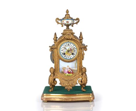 French mantel clock 19th Century, gilt painted, the painted porcelain clock face with Roman numerals, on a gilded wooden baiz