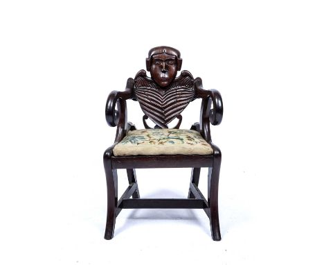 Carved childs chair with a skeleton backon sabre legs with a drop in seat, 64 cm high x 39cm wideOld faults and repairs inclu