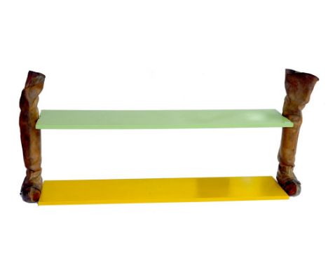 A UNUSUAL GREEN PAINTED WOODEN SHELF SUPPORTED BY A LONG PAIR OF LEATHER BOOTS