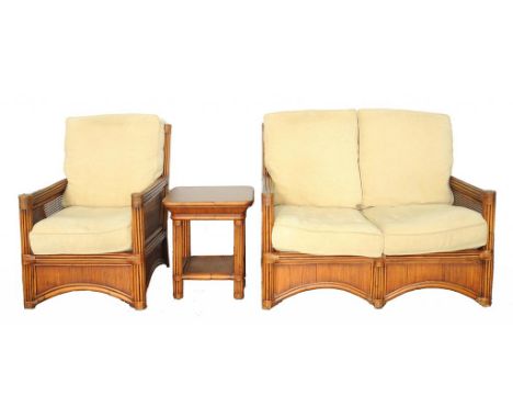 A RATTAN ARMCHAIR, SOFA AND OCCASIONAL TABLE