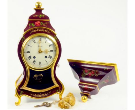 A NEUCHATEL STYLE ZENITH BRACKET CLOCK AND BRACKET DECORATED WITH ROSES ON A DARK RED GROUND, LATE 20TH CENTURY