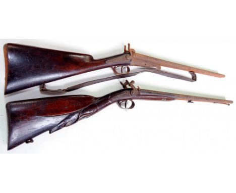 A 12 BORE DOUBLE BARREL PERCUSSION SHOTGUN, THE WALNUT STOCK CARVED WITH THE HEAD OF A DEER, 19TH CENTURY AND A 19TH CENTURY 