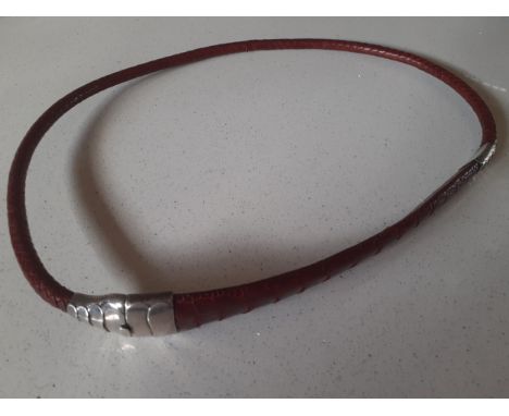 A vintage red dyed braided leather belt having a snakeskin design with silver clasp and  collar stamped 925, approx 90cm long