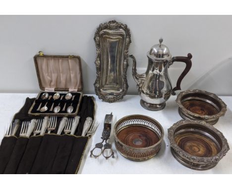 Mixed silver plate to include wine coasters, tea pot, candle snuffer and other itemsLocation:If there is no condition report 