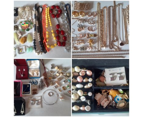 A quantity of vintage costume jewellery comprising mid 20th Century clip on earrings, bead necklaces, stone pendants, tie cli