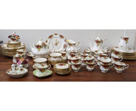 A large quantity of Royal Albert ' Old Country Rose' pattern to include a coffee pot, teapot, a clock, dinner plates, side pl