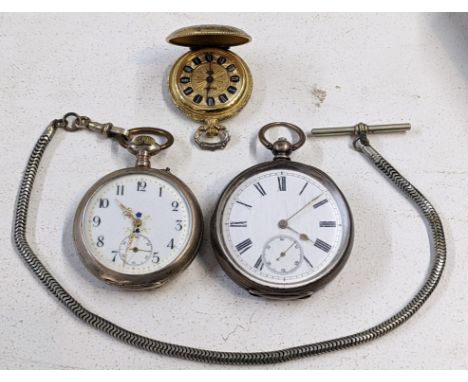 Two late 19th/early 20th century silver open face pocket watches, together with a later gilt fob watch Location:If there is n