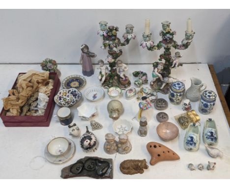 A collection of collectable ceramics to include two Meissen candelabras A/F, a Lladro Nao Daisa figurine, a Dresden miniature