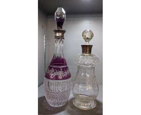 Two silver coloured decanters to include a 1920's decanter with etched Adams style decoration and a Bohemian cut crystal deca