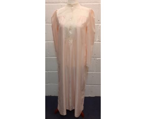 Christian Dior- A pink satin full length ladies night gown having cream lace insertions, approx 36/38" chest. Location:RailCo
