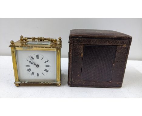 An early 20th century brass carriage clock together with a leather travel caseLocation:If there is no condition report shown,
