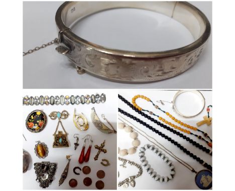 A quantity of costume jewellery to include a silver framed Wedgwood blue Jasperware pendant, a silver pendant with central Ti