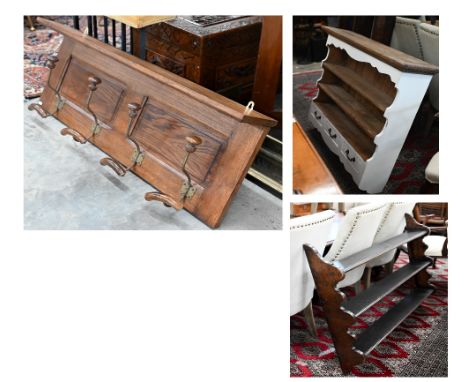 A panelled oak hall shelf with four wrought iron hat/coat hooks, 100 cm wide x 40 cm high to/w a part-painted pine and a maho