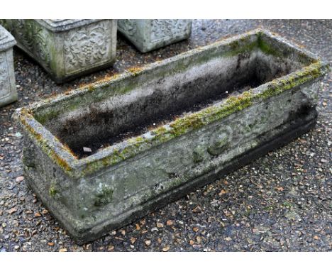 A Georgian style weathered cast stone garden trough planter 