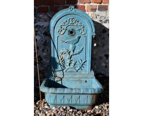 A weathered old cast iron two piece garden wall mount fountain, with basin - no fittings and as removed 