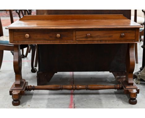 A Victorian mahogany two drawer console or side table on shaped supports united by a turned stretcher, 120 x 56 x 74 cm high 