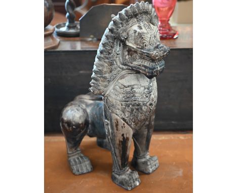 An Asian bronzed ceramic temple lion, 53cm high 