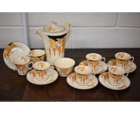 An Art Deco Crown Devon pottery coffee service, printed and painted with wisteria, including coffee pot, cream and sugar, six