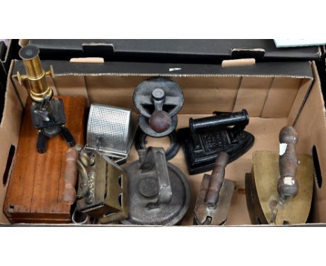 A vintage boxed student's microscope, to/w three antique 'hot stone' irons and a flatiron, a spice/coffee grinder, etc (box) 