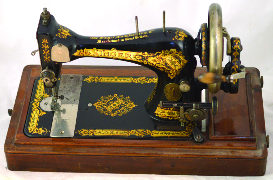 SINGER SEWING MACHINE. 10.5ins tall, cast iron black with gold