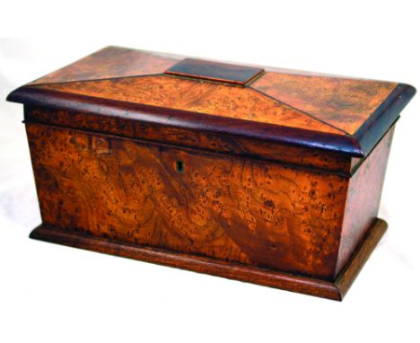 TEA CADDY. 19th century maple (?) wooden tea caddy, sarcophagus shape. 6.6ins tall, 13.5ins long. Interior with 3 compartment