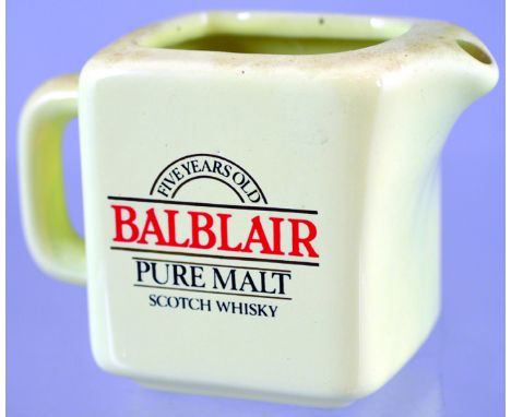 BALBLAIR PUB JUG. 3.5ins tall, off white glaze, red & black transfer FIVE YEARS OLD/ BALBLAIR/ PURE MALT/ SCOTCH WHISKY. Very
