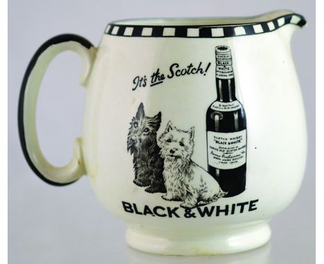 BLACK &amp; WHITE SCOTCH PUB JUG. 4.25ins tall, white glaze body, black transfer ITS THE SCOTCH/ BLACK &amp; WHITE with 2 Sco
