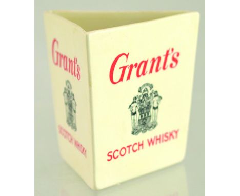 GRANTS TRIANGULAR SHAPE PUB JUG. 3.75ins tall, white glaze body GRANTS/ SCOTCH WHISKY in red & black lettering to 3 sides. Wa
