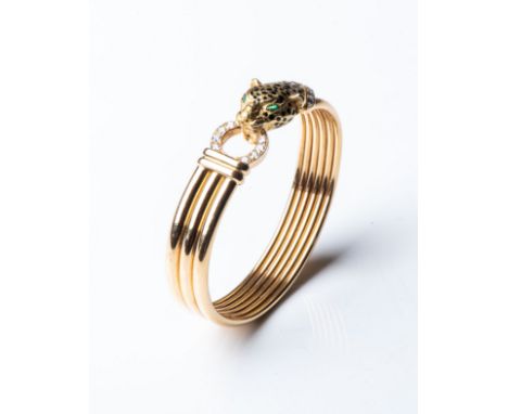 A GOLD CARTIER-STYLE LEOPARD BANGLE Pavé-set to the side with 0,40 carats of round brilliant-cut diamonds, GH colour, VSSI cl