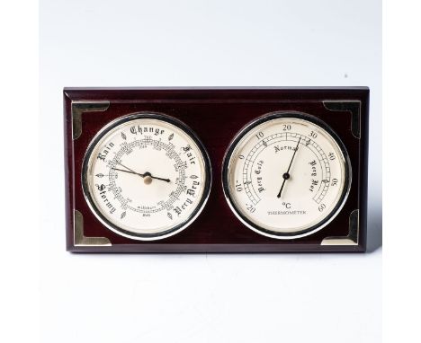 A BAROMETER AND THERMOMETER SET, MODERN  The pair of matching dials 10cm in diameter on a stepped ebonised base, 14cm high, 2