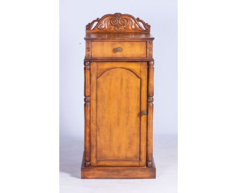 A FRUITWOOD DINING ROOM PEDESTAL CUPBOARD  The square top with a scroll-carved back panel above a single drawer with a panele