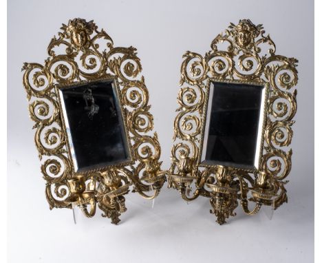 A PAIR OF GILT METAL MIRRORED THREE-LIGHT WALL SCONCES, LATE 19TH/EARLY 20TH CENTURY  45cm long, 7cm width (2) 