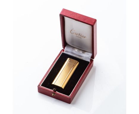 A GOLD-PLATED CARTIER LIGHTER  Accompanied by original box and papers, 6,8cm high 