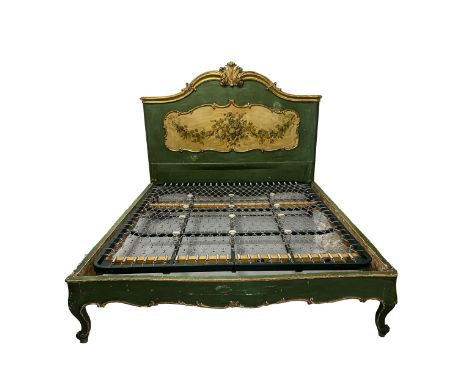 A VENETIAN A GILT AND PAINTED BED The shaped head board surmounted by C-scrolls and centred by a scroll cresting above a flor