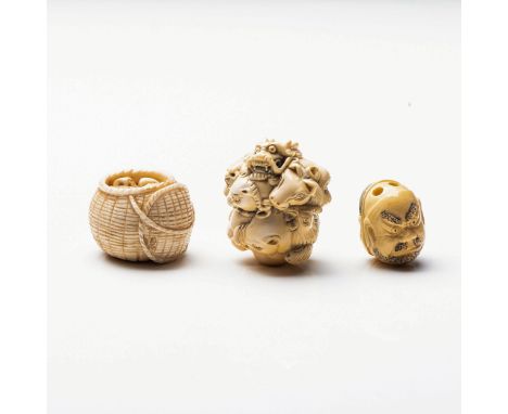A JAPANESE IVORY 'ZODIAC BALL' NETSUKE Carved as a cluster of heads representing zodiac animals; together with a 'Noh Mask' n
