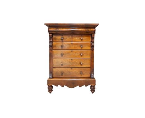 A Victorian mahogany 'Scotch' chest, storage cupboard to top with hinged cover, flared cornice above two short and four long 