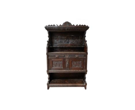 A large late 19th Century Flemish carved oak buffet, the carved cornice with scrolls and acanthus leaf decoration, gadrooned 