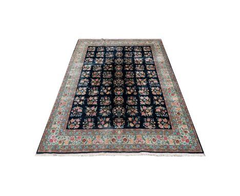 An early 20th Century Tabriz carpet, with floral panels, 318 x 240cms. 