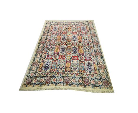 An early 20th Century Kirman carpet, with floral panel design, 371 x 259cms.