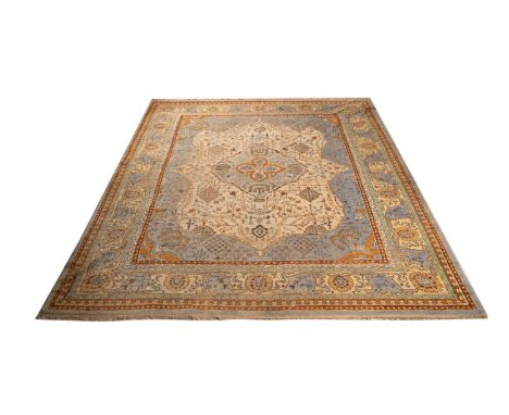 A Ushak carpet, with stylized floral design, 455 x 370cms.