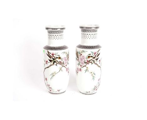 A pair of 20th-century Chinese famille rose rouleau vases, decorated with jays on blossomed branches, Nian Qian Zhilong seal 