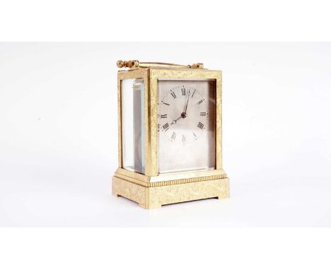 Vieyres of London: A late 19th Century engraved gilt brass carriage clock, with silvered Roman dial, platform lever escapemen