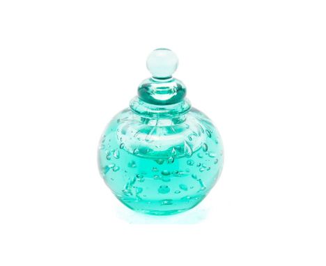 A Sunderland green glass dump inkwell and cover with bubble inclusions, 15cms.