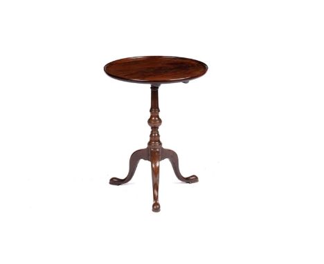 A Georgian mahogany tripod wine table, the circular top with a raised edge, on a turned column stem with downswept legs, 47 x